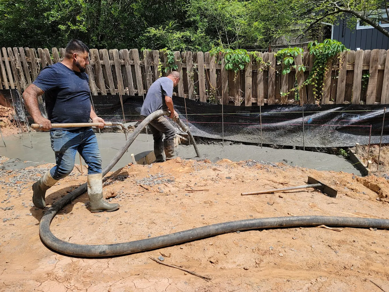 Concrete footing being poured